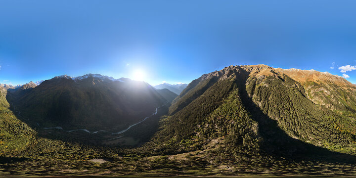 panoramic shot of a mountain range in summer on a sunny cloudless day. bare rocky cliffs