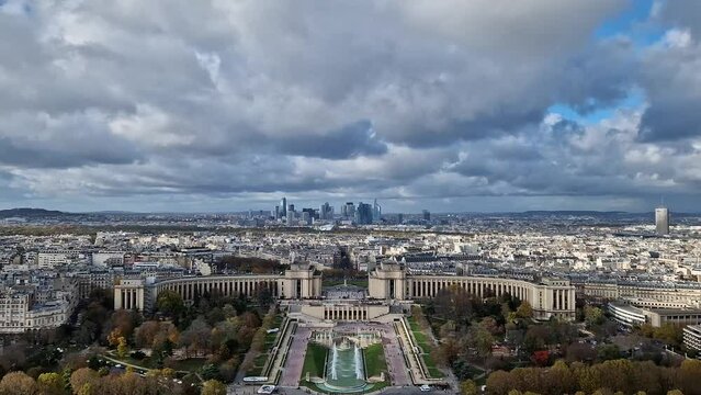 Scenery view from the Eiffel tower height to the Paris cityscape, France. Trocadero area and La Defense metropolitan district seen at the horizon