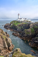 Fanad Head Lighthouse with its rough cliffs in the northern part of Republik of Ireland © Uwe
