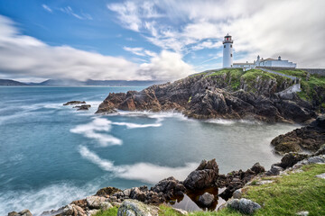 Fototapeta na wymiar Fanad Head Lighthouse with its rough cliffs in the northern part of Republik of Ireland