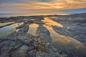 rocky coastline at sunset in southern Republic of Ireland near Annestown