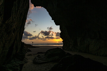 Gruta das encantadas na Ilha do Mel, Paraná Brasil. Sunrise on the beach. - obrazy, fototapety, plakaty