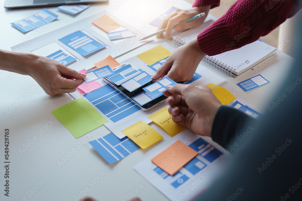 Wall mural group of ux ui or designers working to create content of mobile applications. creative digital devel