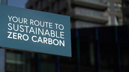 Your route to sustainable zero carbon on a sign in a city