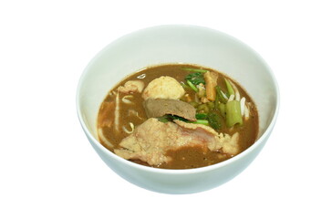 boiled braised pork and meatball in black herb soup on bowl