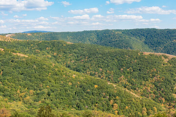 Obraz premium mountain ranges are green and yellow in daylight
