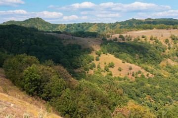 Obraz premium mountain ranges are green and yellow in daylight