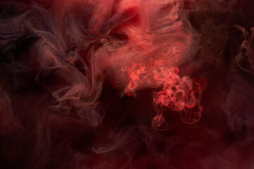 Obraz premium Red ink abstract background. Acrylic paint backdrop for perfume, hookah, cosmetics. Mysterious smoke clouds, colorful fog