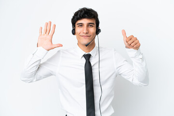 Telemarketer man working with a headset isolated on white background counting six with fingers