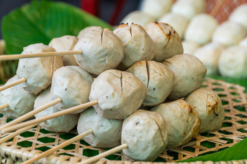 Big Toasted meatballs. Asian Thai street food style. Giant Grilled meat balls stick.