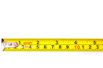Yellow carpenter measuring tape with centimeters isolated on white background. Construction tool.