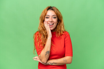 Young caucasian woman isolated on green screen chroma key background with surprise and shocked...
