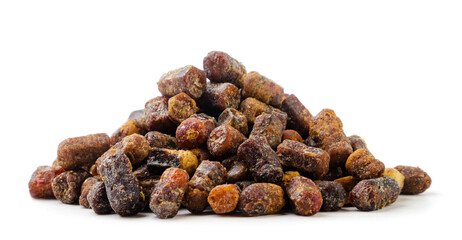 Heap of bee perga, bee pollen granules on a white background. Isolated