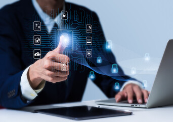 In order to gain access to a private system. Biometric fingerprint scanning enables secure network access. On a laptop computer, a person is using finger print authentication technology.