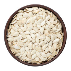 Full bowl of pumpkin seeds isolated on white background. File contains clipping path.