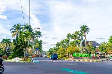 Idjen Boulevard is a landmark of Malang city with large pedestrian streets under palm trees and old...