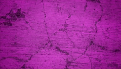 Fototapeta premium A textured purple concrete wall with a prominent vertical crack. 