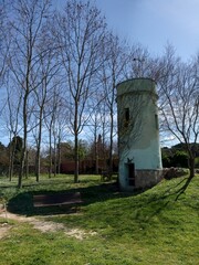 Fototapeta na wymiar Old tower building in the park Celrà Girona Spain