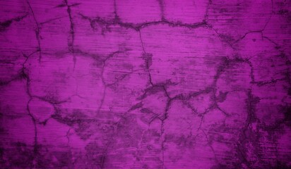 A textured purple concrete wall with a prominent vertical crack. 