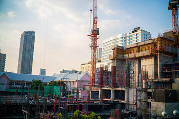 High rise construction site office building with crane