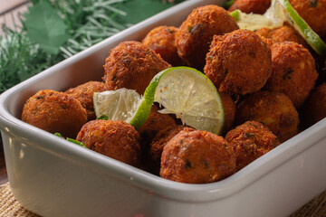 Codfish ball. cod croquette with potato is a traditional Portuguese dish. in Brazil called bolinho de bacalhau. Served at Christmas Dinner