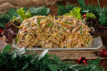 Codfish salad. Salpic&atilde;o is a typical Brazilian salad, made with shredded cod, raisins, grated carrots, straw potatoes and mayonnaise..Served for Christmas dinner