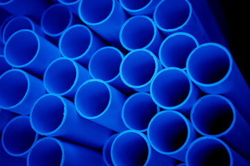 Background of the blue plastic pipes in stacked