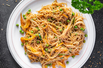 rice noodles with vegetables Asian dish fresh delicious snack healthy meal food snack diet on the table copy space food background rustic top view keto or paleo diet veggie vegan or vegetarian food 