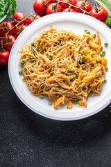 rice noodles with vegetables Asian dish fresh delicious snack healthy meal food snack diet on the table copy space food background rustic top view keto or paleo diet veggie vegan or vegetarian food 