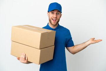 Delivery man over isolated white background with shocked facial expression