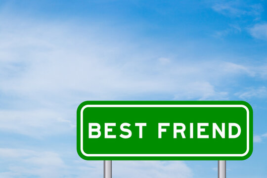 Green color transportation sign with word best friend on blue sky with white cloud background
