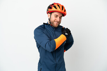 Young cyclist man isolated on white background suffering from pain in shoulder for having made an effort