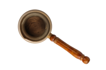 turka, a copper coffee pot with a wooden handle, isolated on a white background