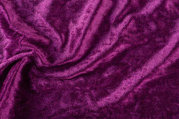Fototapeta na wymiar Beautiful purple silk satin background. Soft folds on a shiny fabric. Birthday, Christmas, Valentine's Day. Luxury background with copy space for text, design, web banner.