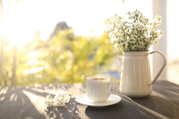 Coffee cup and Marguerite flower