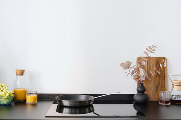 induction stove and black countertop at kitchen