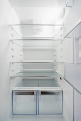 Fototapeta premium closeup of white clean refrigerator for store food, inside view