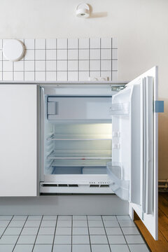 small fridge built in cupboard in kitchen
