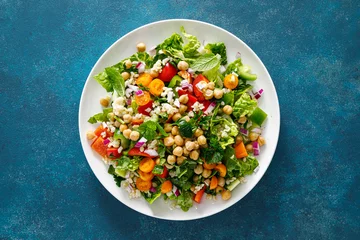 Fotobehang Tabbouleh salad. Tabouli salad with fresh parsley, onions, tomatoes, bulgur and chickpea. Healthy vegetarian food, diet. Top view © Sea Wave