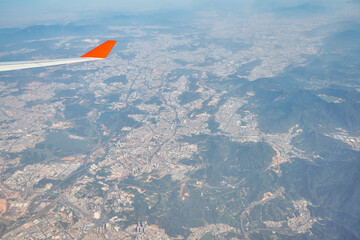 Naklejka na ściany i meble Aerial view from jet aircraft after take-off from Hong Kong International Airport.
