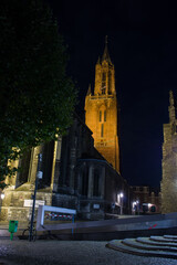 Fototapeta na wymiar Red tower of the church of Saint John at night in Maastricht in the Netherlands