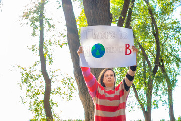 woman in nature with climate change banner