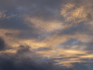 Fototapeta premium Clouds in the blue sky before sunset, background and texture