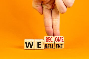 We become or believe symbol. Concept word We believe We become on wooden cubes. Beautiful orange table orange background. Businessman hand. Business we become or believe concept. Copy space.