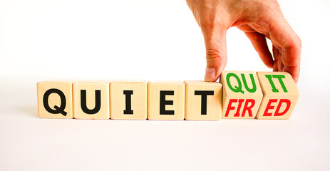 Quiet quit or fired symbol. Concept words Quiet quit and Quiet fired on wooden cubes. Businessman...