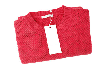 White blank rectangular clothing tag, label mockup template on red knitted sweater isolated on white background . Price tag label with copy space for text