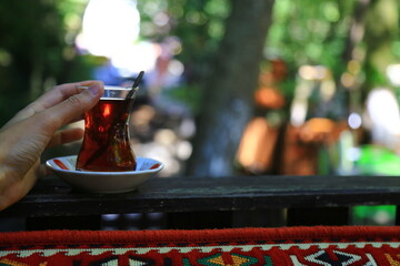 Photo of tea in a glass cup in an authentic place