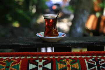 Photo of tea in a glass cup in an authentic place