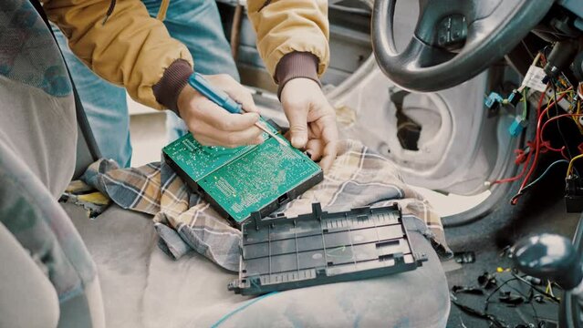 Professional car mechanic repair service and checking car failure ECU module