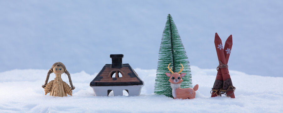 concept of christmas, toy house in the snow